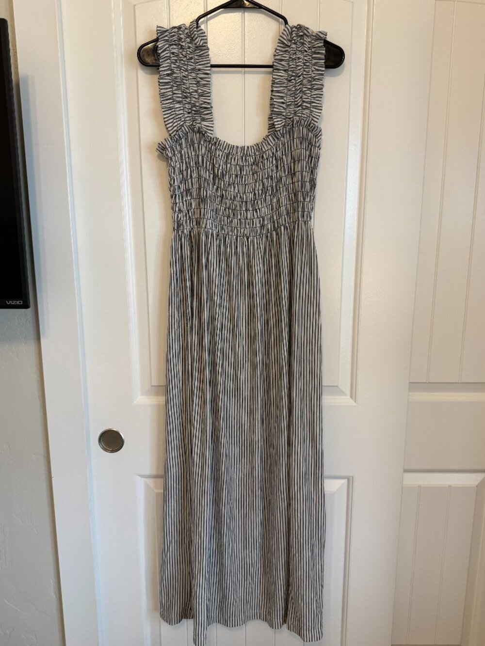 Lovely striped maxi dress featuring a smocked bodice and ruffled straps